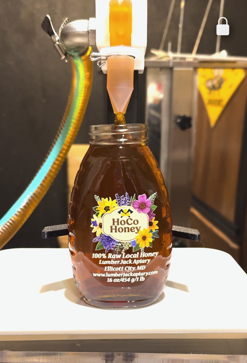 HoCo Honey jar being filled on the bottling line